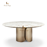 Table à manger ovale de luxe italienne 8 places avec plateau en marbre et pieds en acier inoxydable pour villas et salles à manger