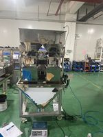 Balance pondérale linéaire à 2 têtes pour granulés alimentaires, haute précision, fabriquée en Chine, pour ensachage automatique de film, papier et sacs d'énergie