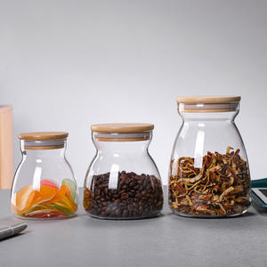 Venta al por mayor múltiples tamaños contenedor de vidrio transparente respetuoso <span class=keywords><strong>con</strong></span> el medio ambiente de alta borosilicato forma de bola de alimentos tarro de vidrio <span class=keywords><strong>con</strong></span> <span class=keywords><strong>tapa</strong></span> de corcho - Product Image 1