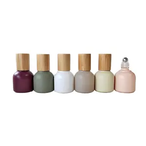 ขวดแก้วสี Morandi พิเศษพร้อมลูกกลิ้งเหล็กและฝาไม้ไผ่จริงน้ำมันหอมระเหยออกแบบเฉพาะบนขวด10Ml