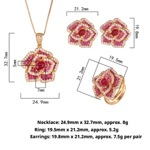 Parure de bijoux de mariée délicate et écologique en cuivre plaqué or avec zircon rouge pavé, motif floral doré, comprenant collier et boucles d'oreilles - Product Image 2