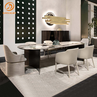 Table à manger longue moderne en marbre avec pieds en acier inoxydable personnalisables pour villa et hôtel