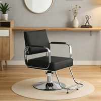 Fauteuil de salon élégant avec base ronde chromée, repose-pieds et dossier inclinable, chaise de barbier hydraulique