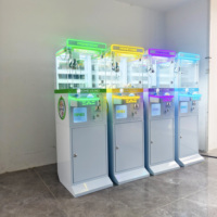 Machine à attraper les mini-poupées géantes à monnayeur, directement de l'usine, compatible avec le lecteur sans espèces Nayax pour centres commerciaux, zones de jeux et lieux de divertissement