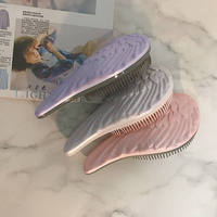 Logo personnalisé en gros ailes d'ange portable démêlant brosse à cheveux flexible antistatique en plastique de massage peigne