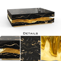 Nouvelle table basse de luxe en marbre noir avec veines dorées pour une décoration intérieure élégante