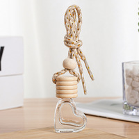 Vente chaude 6ml Diffuseur de parfum de voiture en forme de coeur Bouteille de parfum de voiture suspendue en verre clair vide