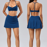 Setelan Olahraga OEM Front Twist Nude Feel Sportswear dengan Rok Tenis Lipit Belakang Berpinggang Tinggi dan Celana Pendek Terpadu untuk Padel Pickleball