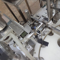 Machine automatique de remplissage et de bouchage de flacons, ligne de production de remplissage et de bouchage de flacons liquides, machine d'emballage