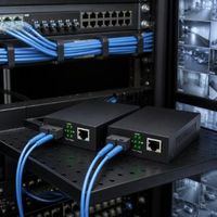 Convertisseurs Transceivers Fibre Optique FTTH 10/100 Haute Vitesse Noir 2.4G pour Scénarios à Grande Échelle Centre de Données École Hôpital SC