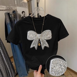 T-shirt casual all'ingrosso 2026 a maniche corte <span class=keywords><strong>con</strong></span> scollo rotondo, fiocco, <span class=keywords><strong>paillettes</strong></span> e stampa motivo burro, traspirante e tinta unita - Product Image 2
