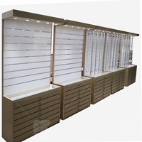 Meuble d'exposition mural stratifié gris, Design de magasin d'optique, armoire de rangement en bois pour lunettes illuminées