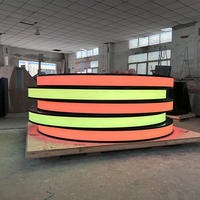 Comptoir de service LED en pierre translucide noire, moderne, rond, pour les zones de cinéma, les bars, les bureaux de réception