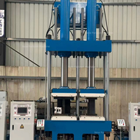 Presse de vulcanisation verticale à double moule pour ressorts pneumatiques, machine de vulcanisation de caoutchouc servo-hydraulique pour suspensions
