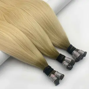 Usine de vente en gros nouvelle extension de cheveux de trame attachée à la main russe invisible distributeurs de cheveux de trame de génie
