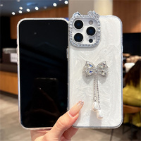 Coque de téléphone de luxe scintillante avec nœud, perles et pendentif pour iPhone 18 17 Pro Max 16 15 14 13, avec cordon perlé et strass oreilles de chat