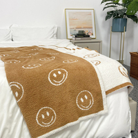 Prix de gros, couvertures en tricot super chaudes à motif de visage souriant pour canapé, lit, décoration d'hiver