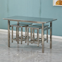 Table et chaises de salle à manger en acier inoxydable de style industriel moderne. Convient aux restaurants, écoles et hôtels.