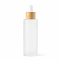 Vente en gros de flacons compte-gouttes en verre givré de 20 à 100 ml avec bouchon en bambou pour sérum facial, huile essentielle, emballage de produits de soin de la peau