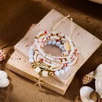 RINHOO Ensemble de bracelets tressés bohèmes en coquillages et perles pour femme, style plage, avec étoiles de mer et perles de riz, bijoux pour fêtes et vacances