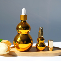 Bouteille d'huile essentielle en verre de gourde de couleur personnalisée bouteille de parfum