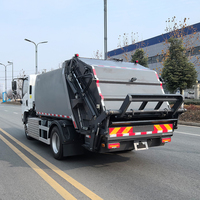 Camion compacteur de déchets électrique pur 4x2 Shacman EV Chassis 7m³ à chargement arrière pour la collecte des ordures et des déchets à vendre