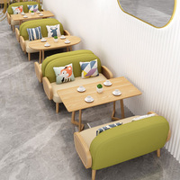 Table et chaise pour salon de thé, bar à livres, café, ou espace de réception, avec canapé de négociation et combinaison table et chaise pour café.