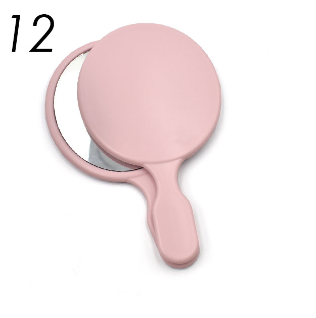 Pink oval handle mirror