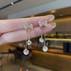 Trendy Gold Plated Zinc Alloy Bow Dangle <b>Hook</b> <b>Earrings</b> with Cubic Zircon and Charm Drop Jewelry for Women Party Gift - Product Image 1