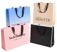 Customized Kraft Paperboard Gift Bag for Clothing Hot Stamping Surface Treatment Recycled Material for Candle Craft Packaging