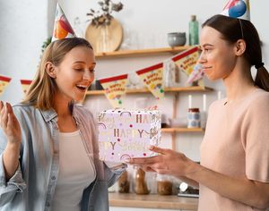 Original pink aluminum-coated <b>paper</b> <b>packaging</b> with gold foil pattern of the letters Happy Birthday and star shapes - Product Image 6