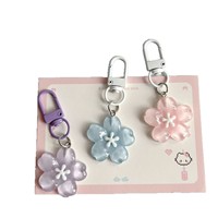 Porte-clés romantique en gelée motif fleur de cerisier, mignon et féminin, en résine plastique translucide, breloque de sac à motif de pétales de fleurs, pour couple et meilleure amie