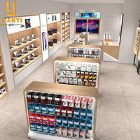 Vitrine d'exposition pour téléphones portables avec logo personnalisé pour la décoration de magasin de téléphonie mobile