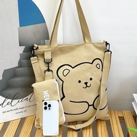 Élégante trousse à crayons en toile avec sangle et fermeture éclair, style frais et doux, sac bandoulière polyvalent pour femme, collection Hiver 2024