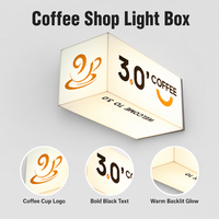 Enseigne lumineuse LED pour café, trois faces, montage en coin, éclairage blanc, texte noir, logo orange pour vitrine de café, signalétique commerciale