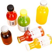 Bouteilles en verre rondes transparentes en gros pour café froid, jus et spiritueux, 8oz, 12oz, 16oz avec bouchon à vis inviolable