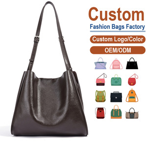 กระเป๋าหนังแท้สั่งทำพิเศษ หนังฟูลเกรนแท้ 100% ทรงเรียวด้านบน ฐานโค้งมน ดีไซน์เรียบหรู พร้อมสัมผัสอบอุ่น - Product Image 1