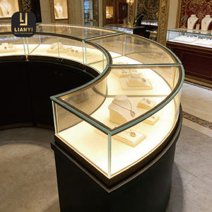Vitrine à bijoux en verre incurvé, design en arc <span class=keywords><strong>fluide</strong></span>, créant un centre d'attention moderne et élégant pour les boutiques de luxe - Product Image 1