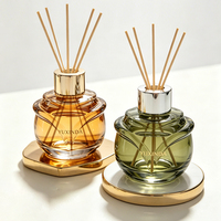 Diffuseur de parfum en verre avec motif floral élégant, flacon vide personnalisé coloré et boîte d'emballage sur mesure