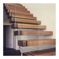 Escalier flottant contemporain en bois massif de noyer américain avec marches en bois et structure de support en acier