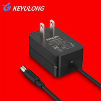 Adaptateur secteur AC/DC 5V-12V 1A-2A, max. 12W, prise EU/US, certifié CE/FCC, pour éclairage LED, caméras de vidéosurveillance, armoires intelligentes