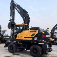 Excavatrice sur pneus Hyundai R210W-9 d'occasion 100% coréenne, 21 tonnes, avec moteur Cummins, pompe et PLC, modèle 2023, équipement pour travaux de terrassement