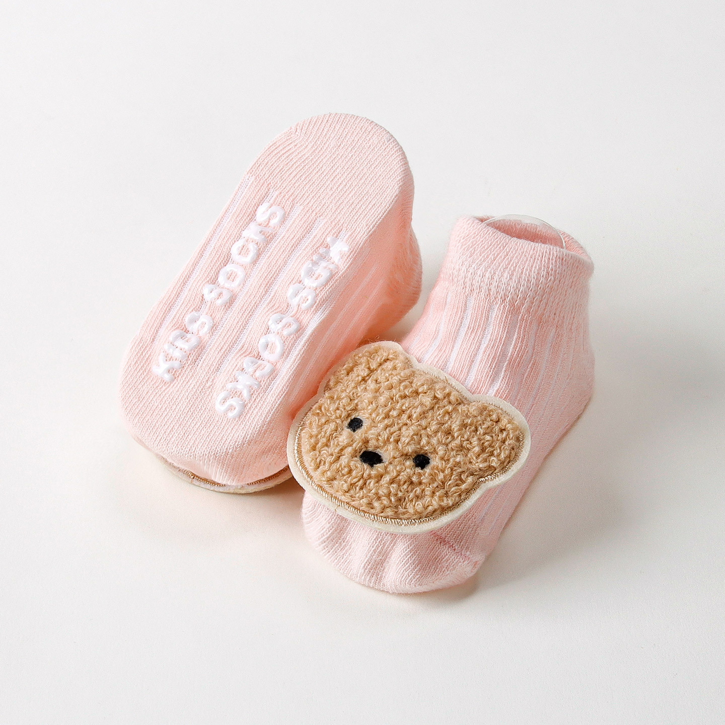 Ours en peluche rose foncé