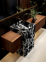 Ensemble de meuble de salle de bain avec lavabo intégré en pierre noire de luxe, sans joint, avec toilettes et lavabo pour la salle de bain.