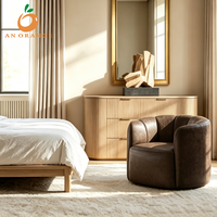 Fauteuil confortable à dossier tonneau pour salon, avec coussin en éponge moelleuse et revêtement en cuir, structure en bois, idéal pour appartement