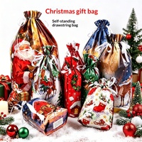 Sacs cadeaux de Noël en gros USA 2026 – Nouveaux sacs en plastique à cordon de serrage autoportants pour décorations et emballages cadeaux (vente transfrontalière)