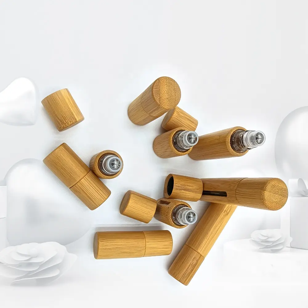 OEM dapat disesuaikan 10ML rol minyak kosong botol parfum bola baja tahan karat dengan kayu bambu/kaca desain Serum minyak esensial