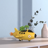 Pot de fleur en forme d'avion de chasse en résine personnalisé Vente en gros de jardinières d'avion de guerre en résine pour la décoration intérieure