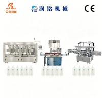 Machine de remplissage entièrement automatique pour liquides visqueux (huile et huile essentielle) Emballage en verre Capacité 200 ml Contrôlée par PLC