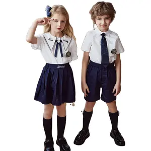 Doğrudan satış anaokulu yaz erkek kız okul forması üniforma özel rozet okul üniformaları Set giyim tasarım hizmetleri